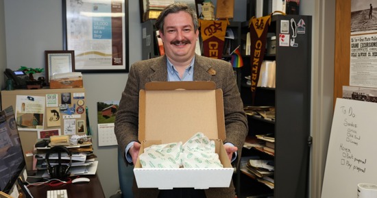 UNK associate history professor Nathan Tye brings Runzas for students in his Nebraska in the World class. The popular fast-food item is one of many examples he uses to teach them about the state’s global connections. (Photo by Erika Pritchard, UNK Communications)